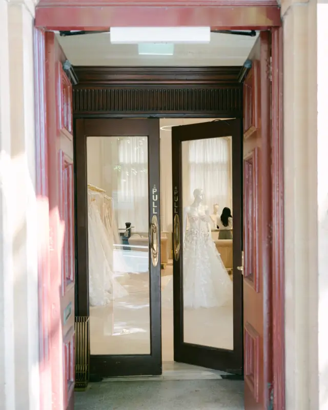 Open doors of the Kayrouz Bridal boutique with gowns inside