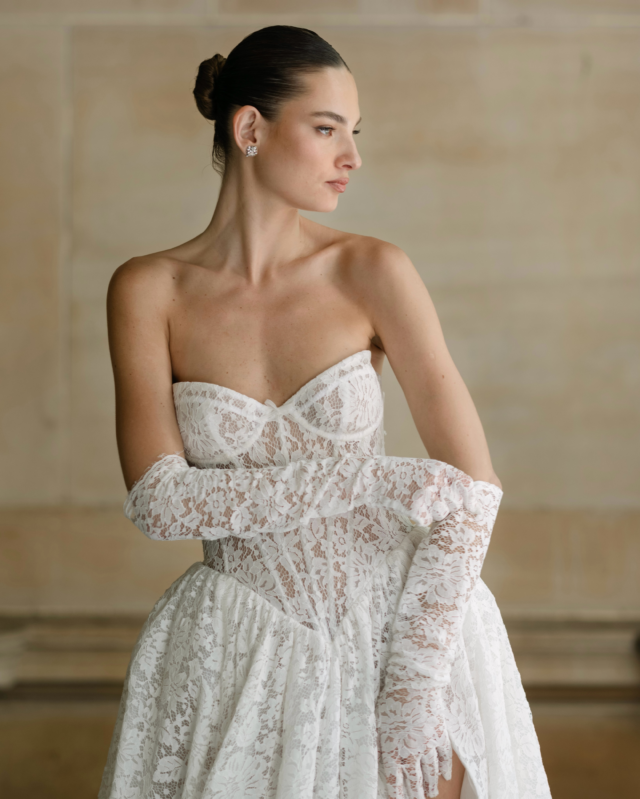 Bride in a lace corset gown with lace opera gloves