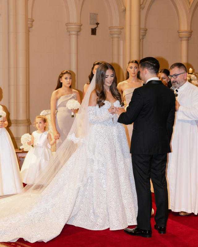 Exchanging rings at the altar in a cathedral