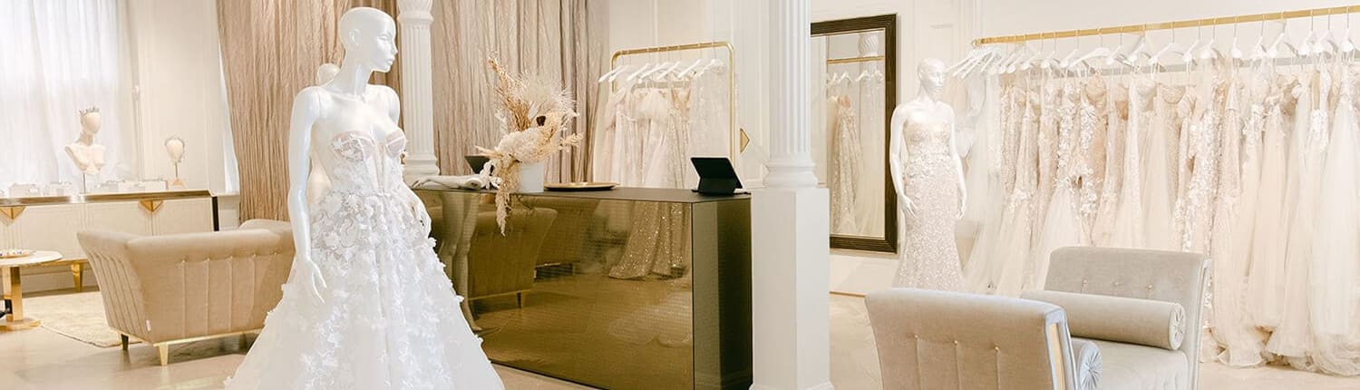 The Kayrouz Bridal boutique interior with gown racks and mannequins