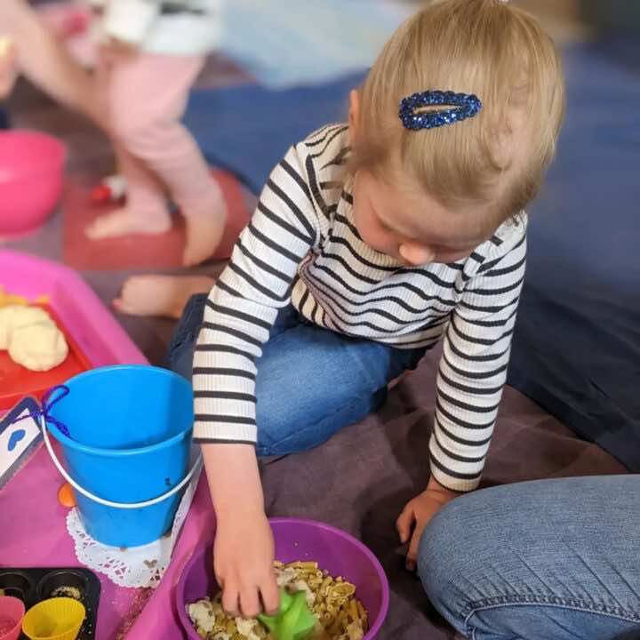 Happy children play in a Little Learners class