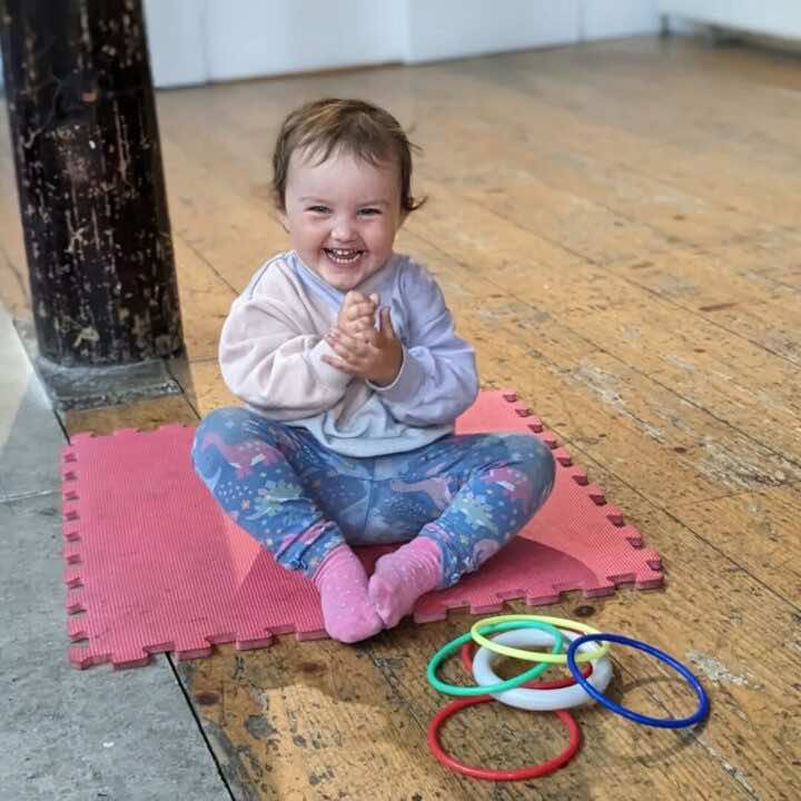 A Little Learner in class smiling 