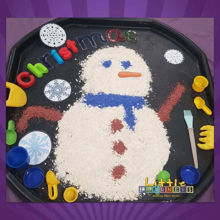 A snowman made of sensory sand dough at a Christmas themed class