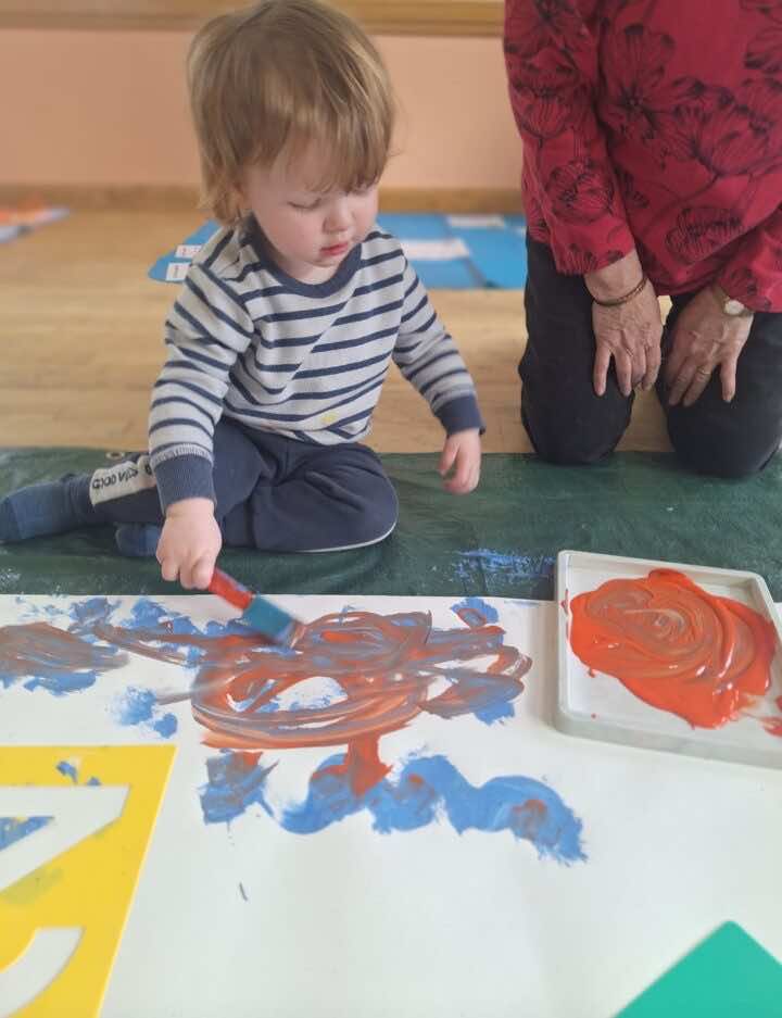 Toddler painting with dabber