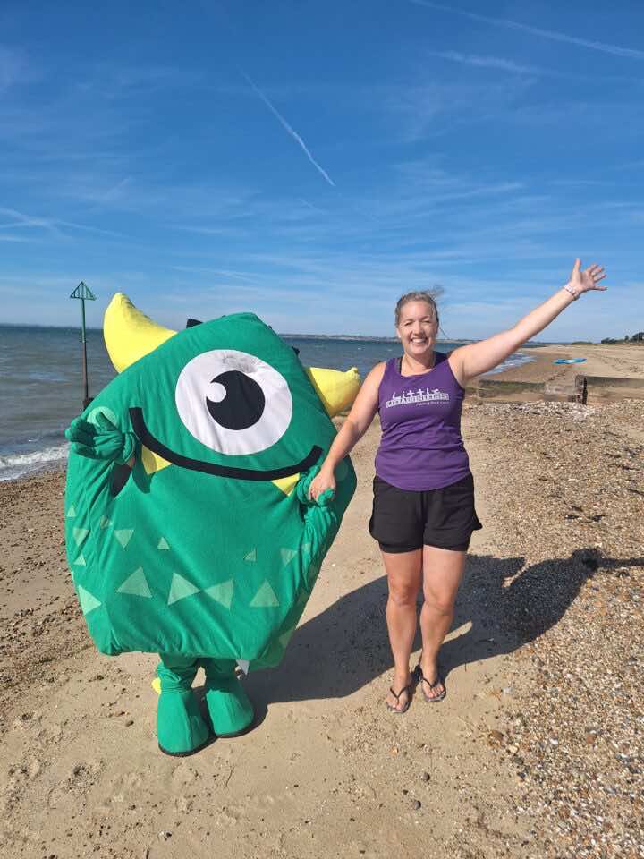 Anita and Ziggy stand near the sea after a messy play class with Little Learners UK